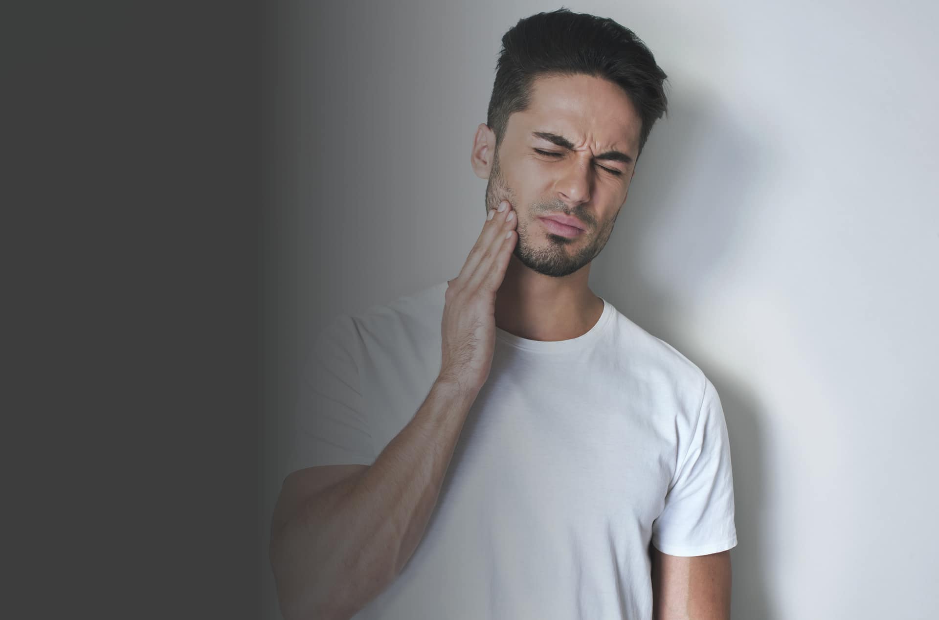 Man suffering with TMJ problems