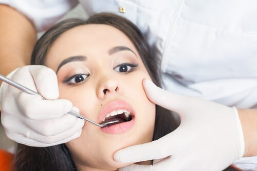 Dentist checking patient's wisdom teeth